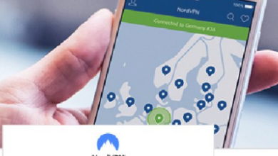Hand holding a smartphone showing a map with multiple location pins from a VPN app (NordVPN).