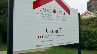 Large outdoor sign for CMHC and the Government of Canada, with a maple-leaf Canada logo, at 700 Montreal Road.